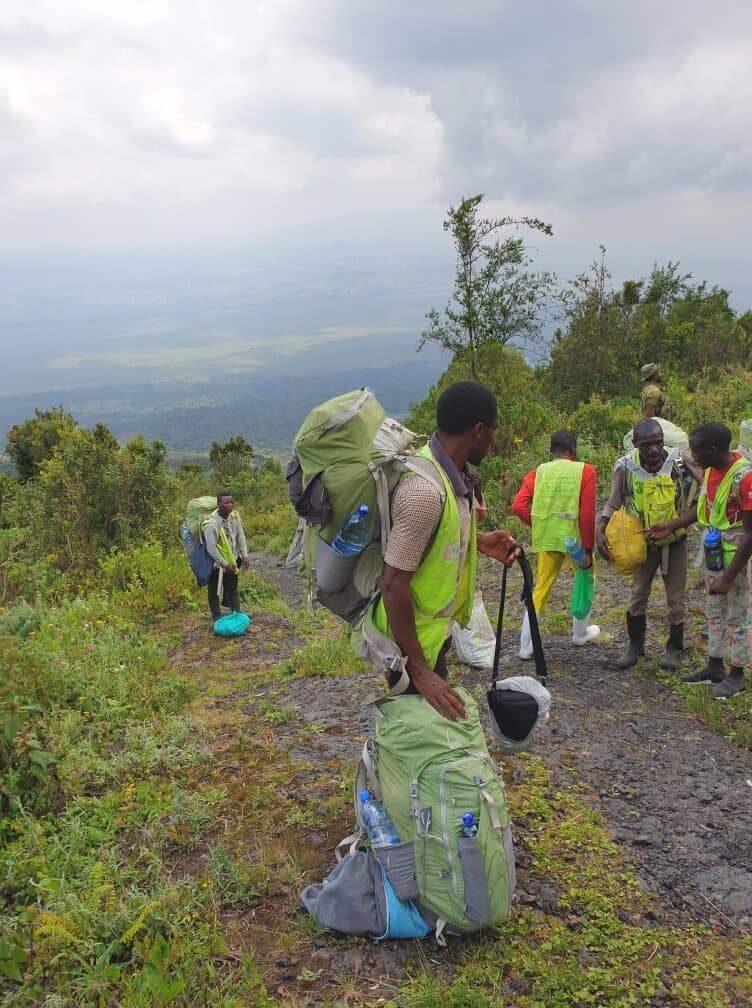 Nyiragongo Volcano Trek Virunga DRC porters backpack