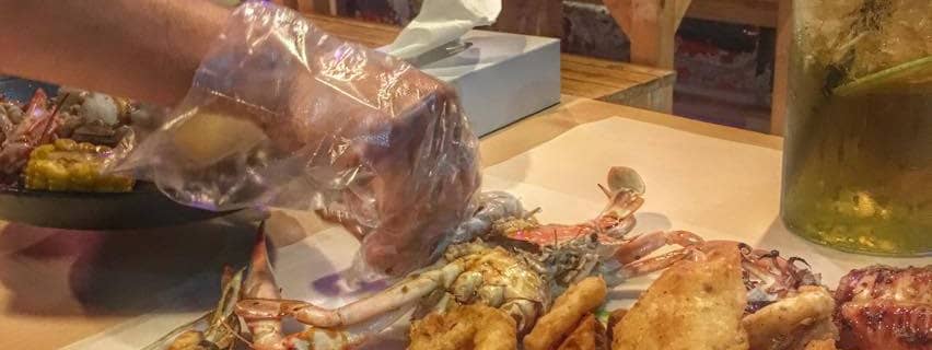 filipino boodle fight in Dubai seafood in a bucket